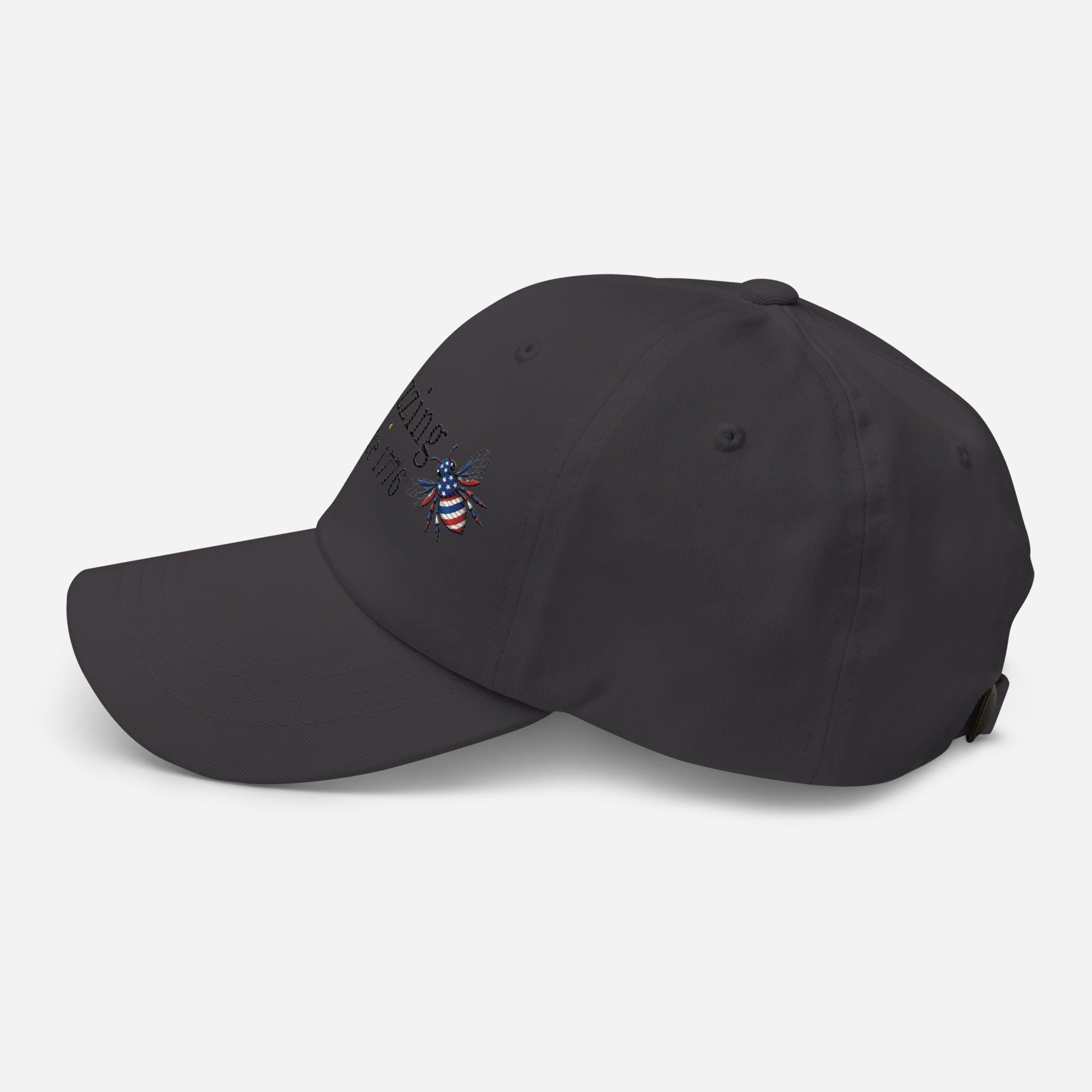 Dark gray dad hat with embroidered bee logo on side, curved brim