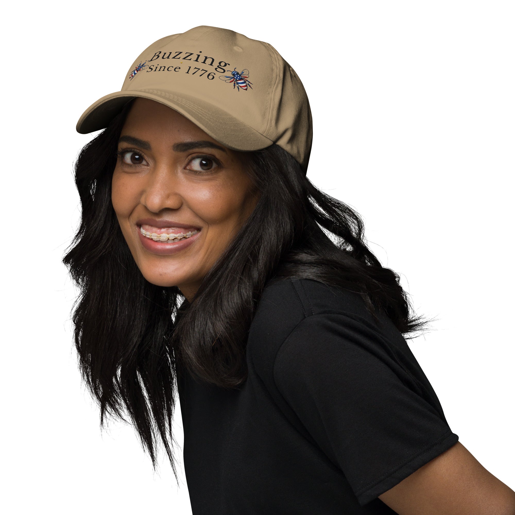Khaki dad hat with embroidered text and small bee patch on the front panel.