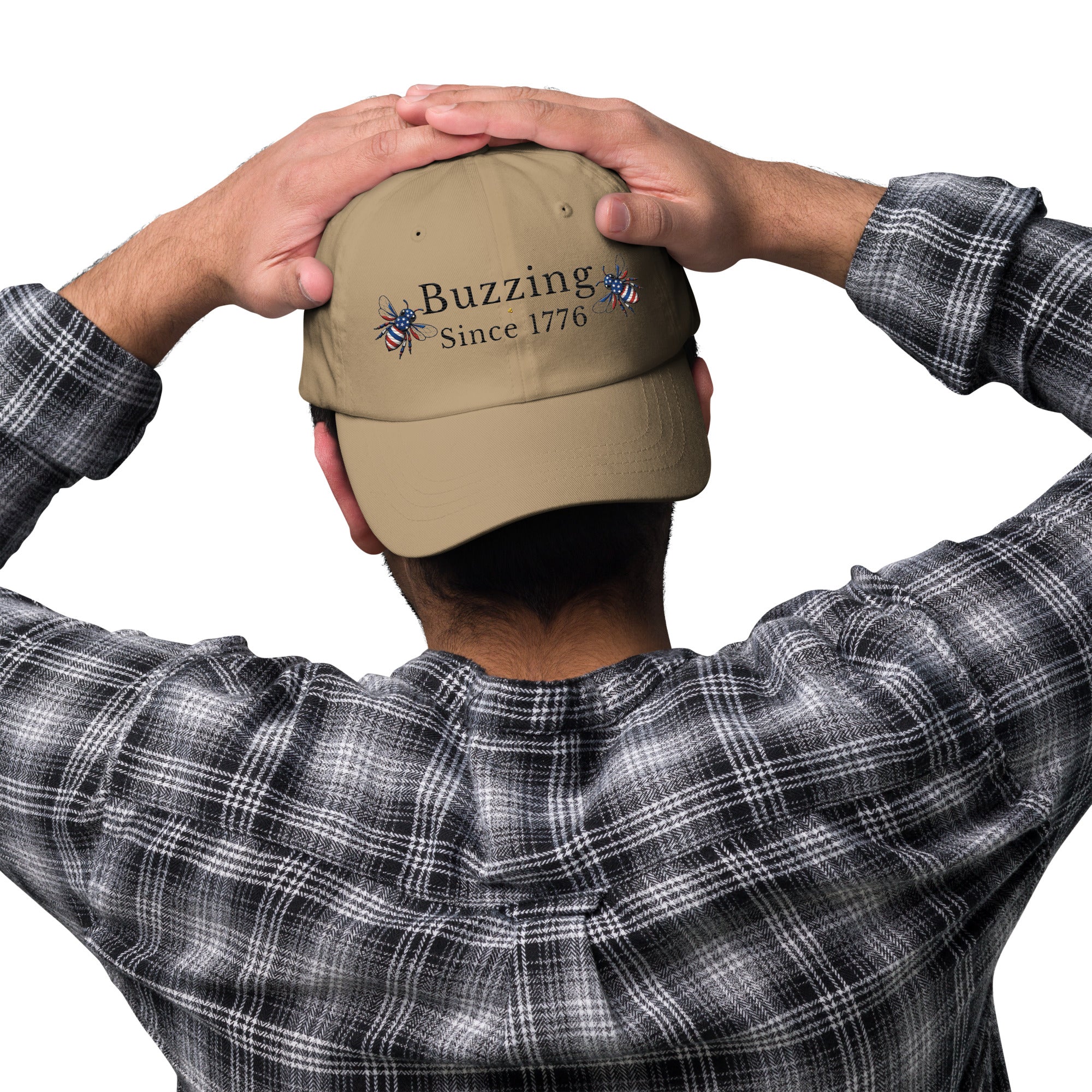 Khaki dad hat with embroidered “Buzzing Since 1776” on back