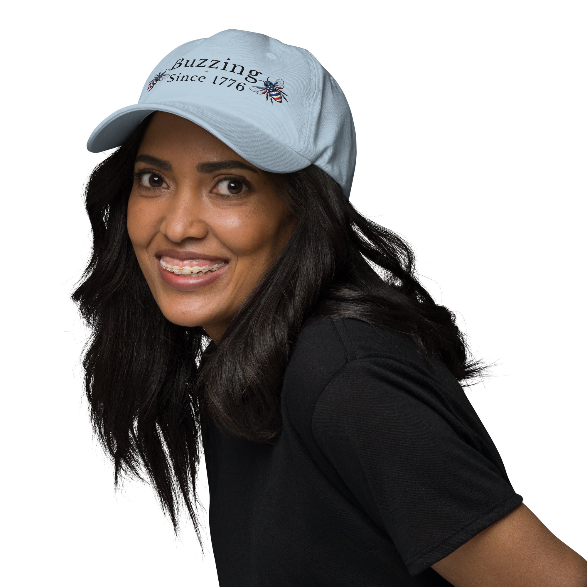 Light blue dad hat with embroidered text and small bee patch on the front.