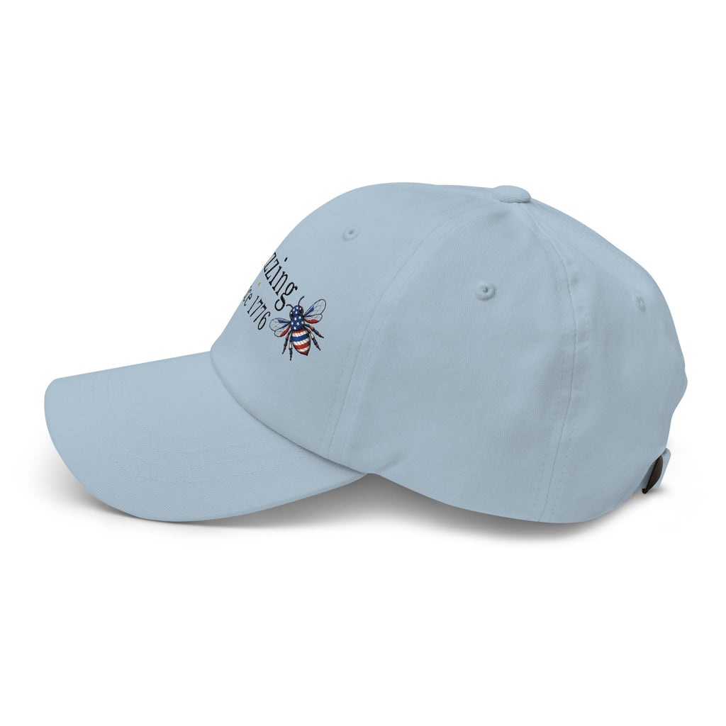 Light blue dad hat with embroidered bee patch on the front panel