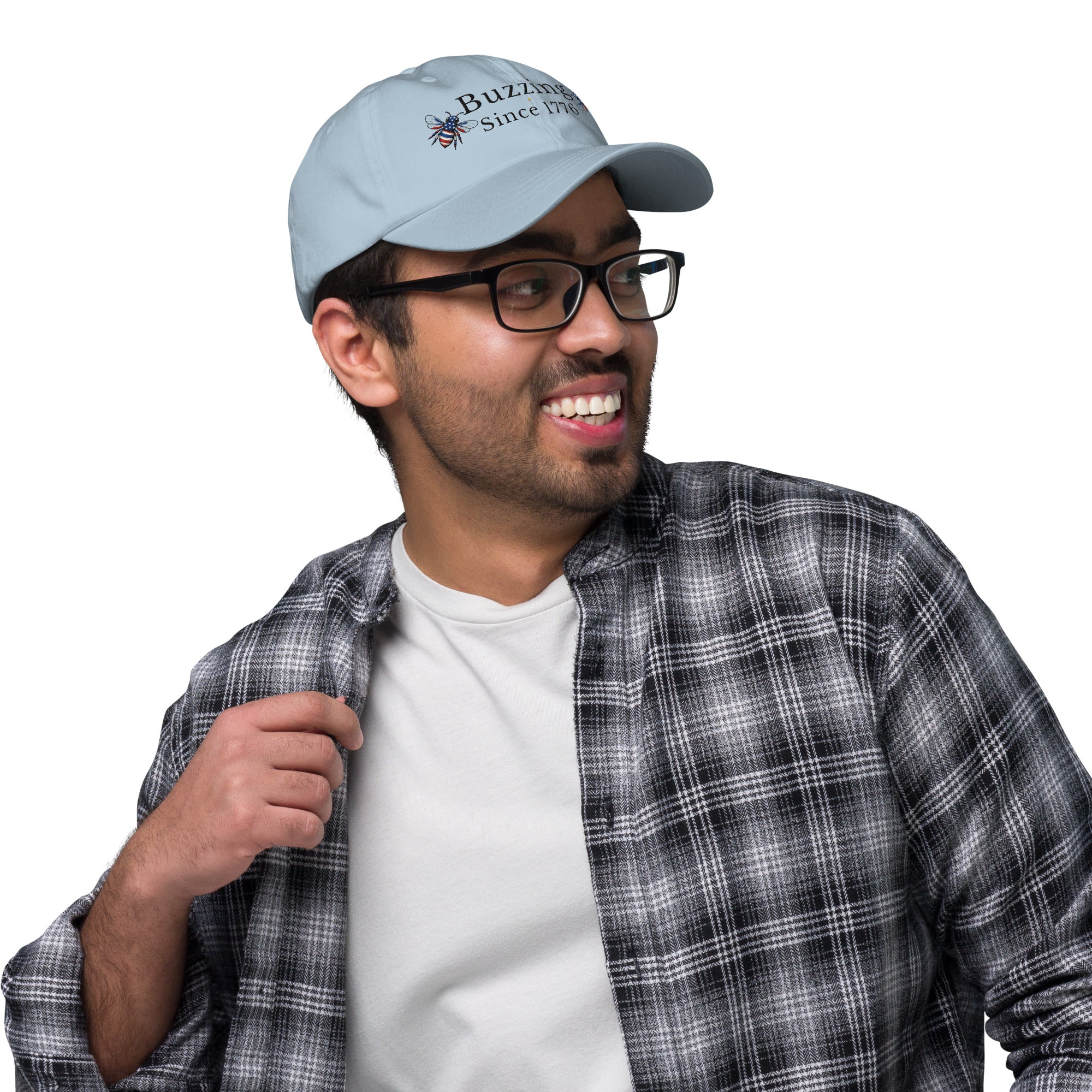 Light blue dad hat with embroidered “Buzzing Since 1776” on front