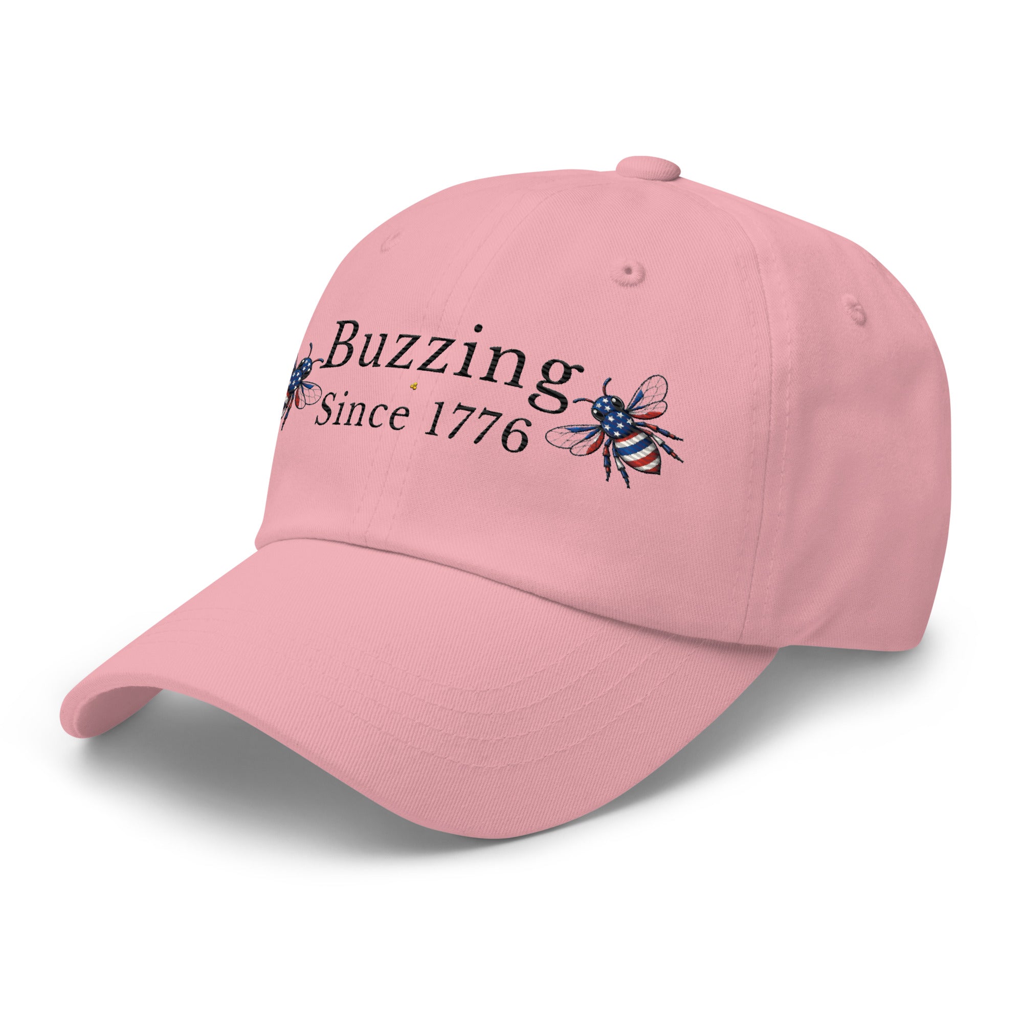 Pink dad hat with “Buzzing Since 1776” and bee graphic