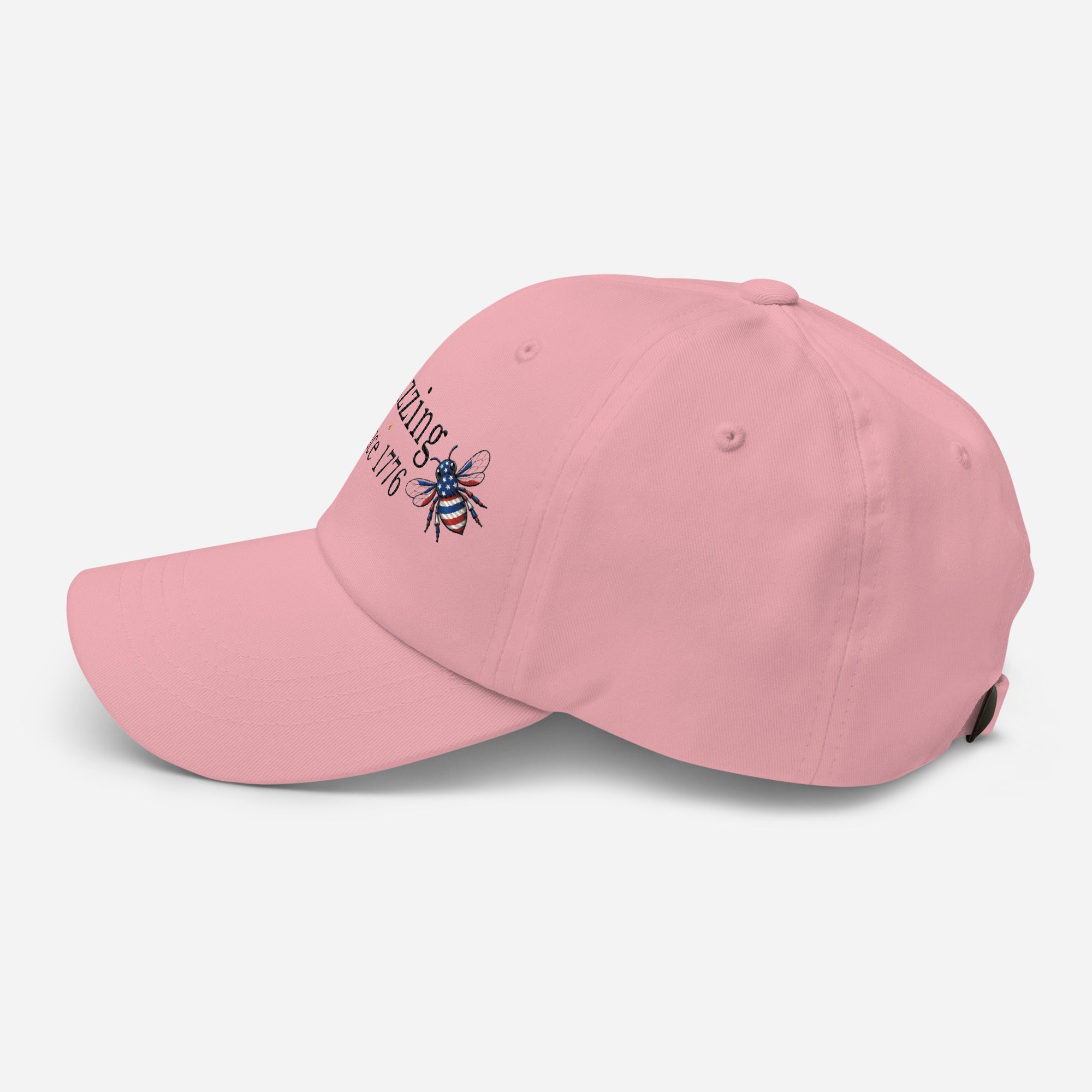 Pink dad hat with embroidered bee logo on side, curved brim