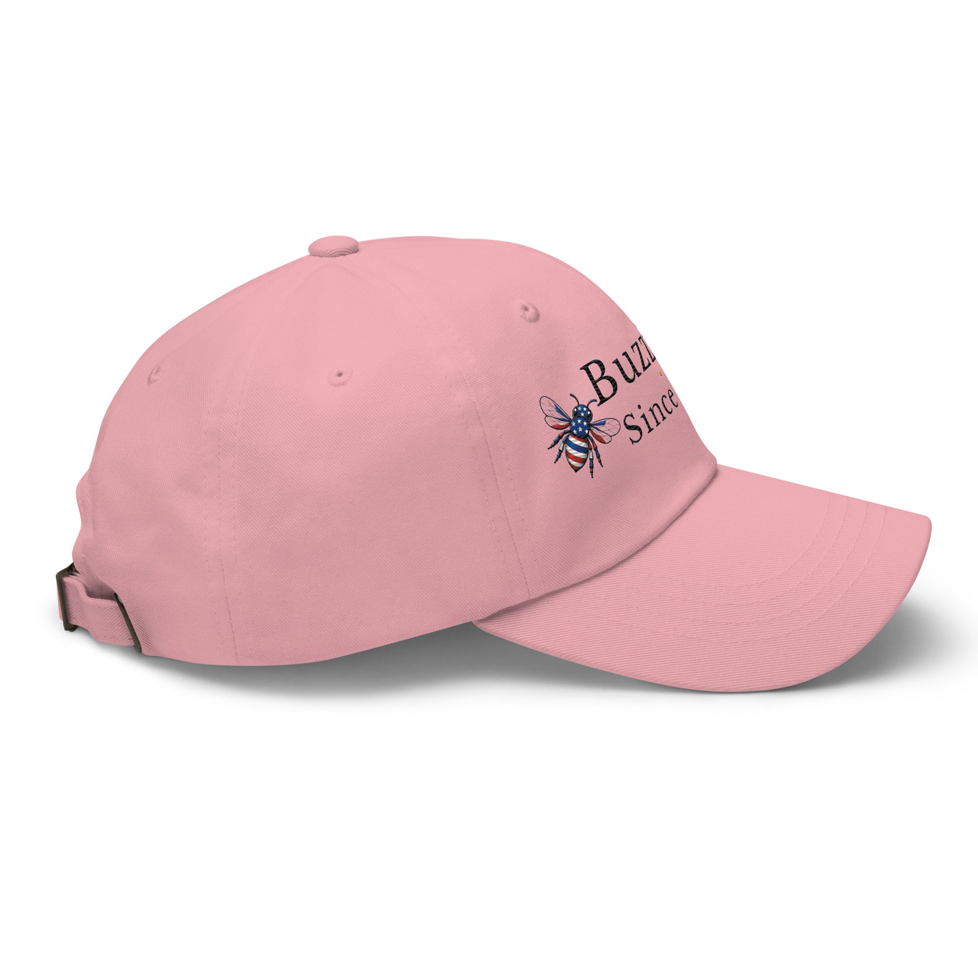 Pink dad hat with curved brim and embroidered bee graphic on side