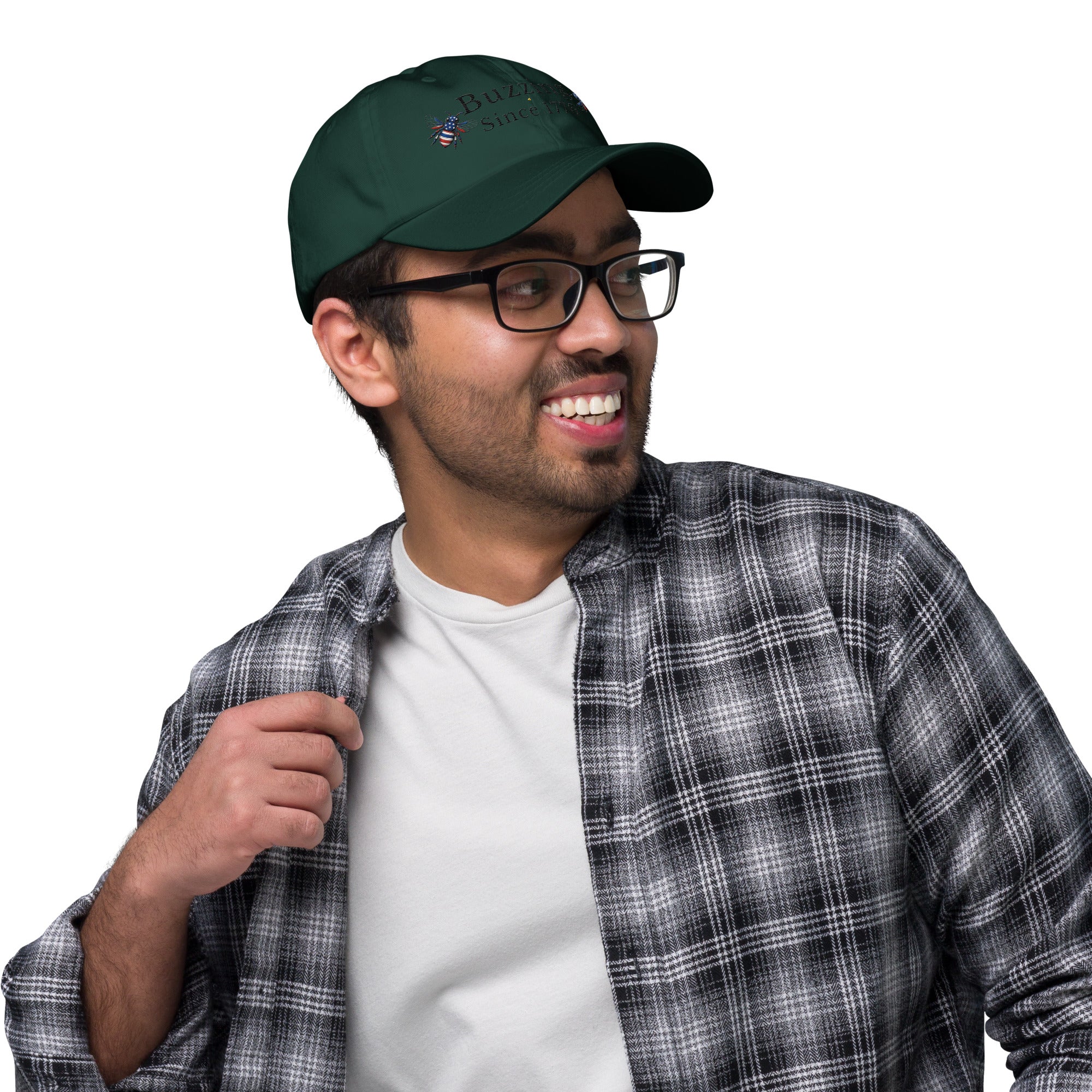 Spruce green dad hat with embroidered bee and “Buzzing Since 1776” text