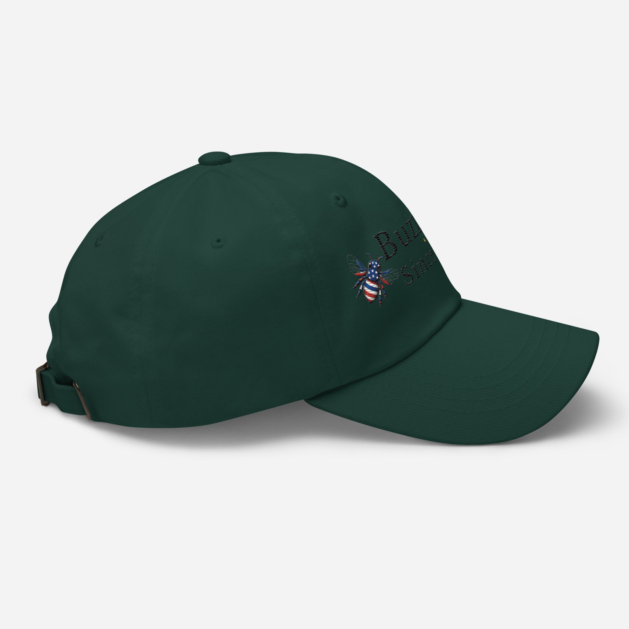 Spruce green dad hat with adjustable strap and embroidered emblem on side
