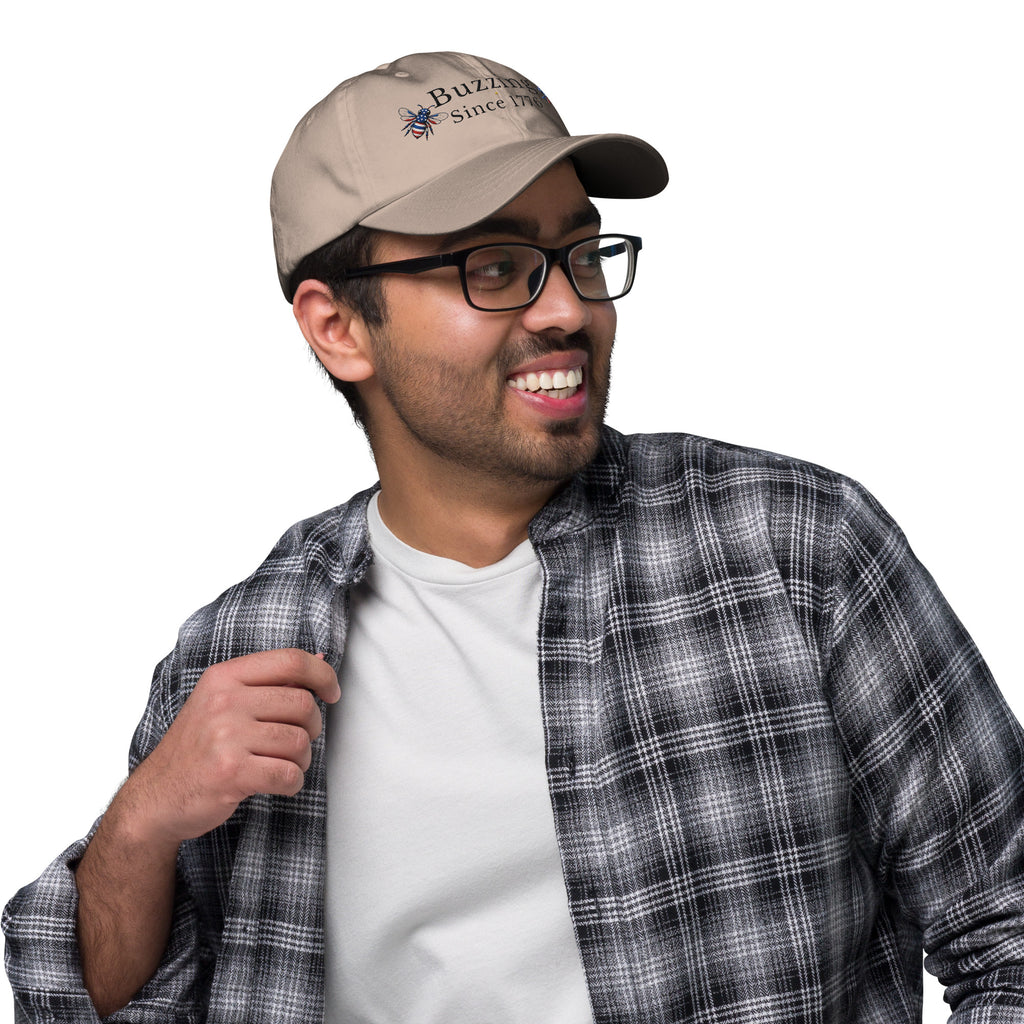 Khaki dad hat with embroidered bee patch and “Buzzing Since 1776” text
