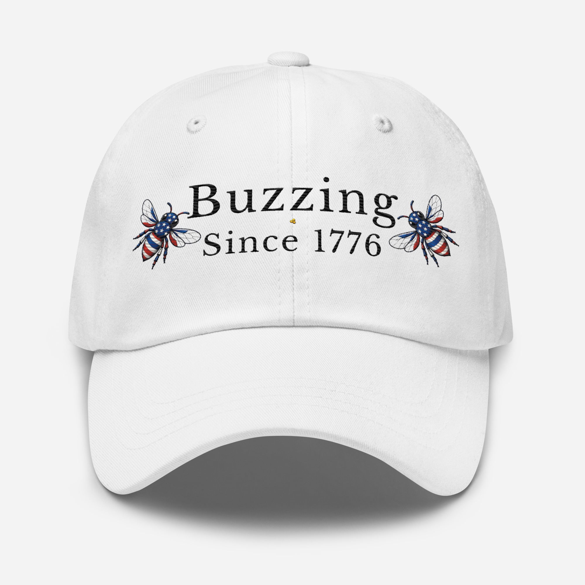 White dad hat with “Buzzing Since 1776” text and bee graphic embroidery on front