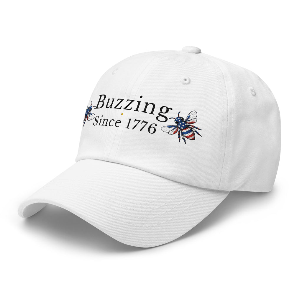 White dad hat with “Buzzing Since 1776” and bee graphic