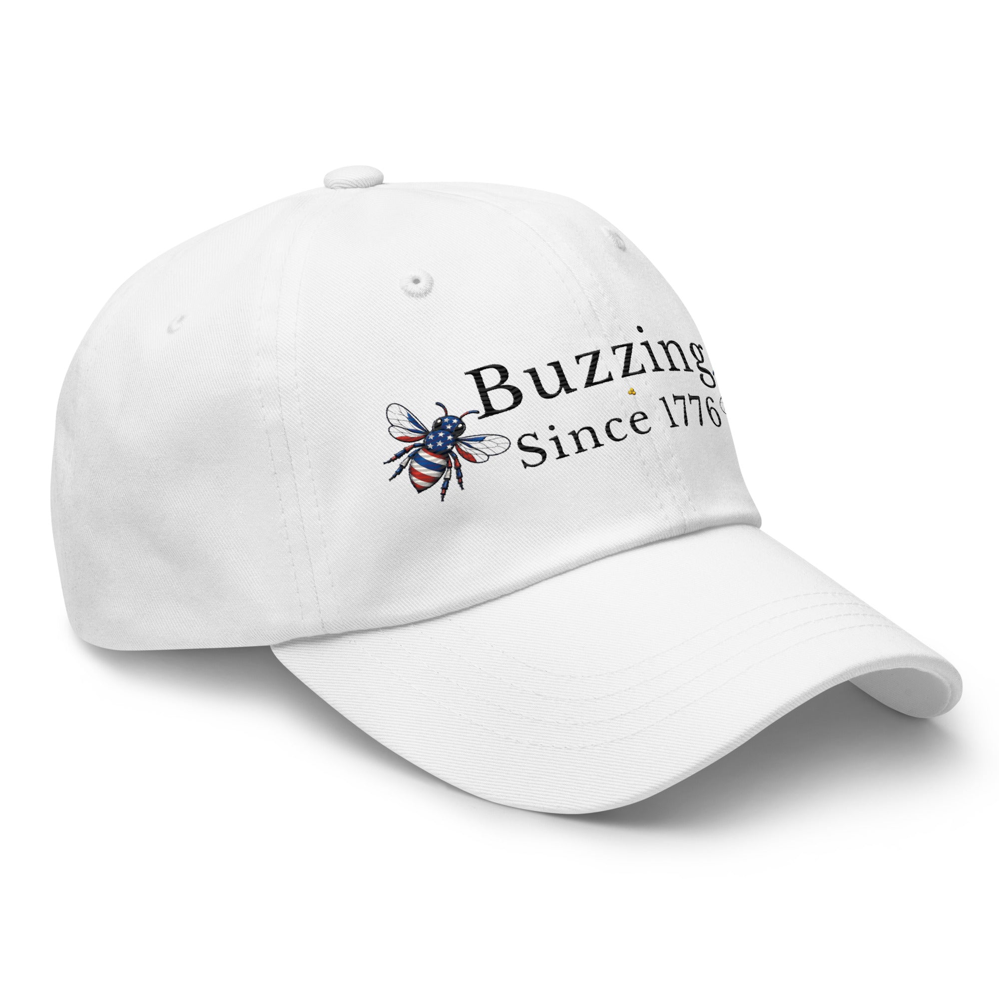 White dad hat with embroidered “Buzzing Since 1776” and bee logo on front