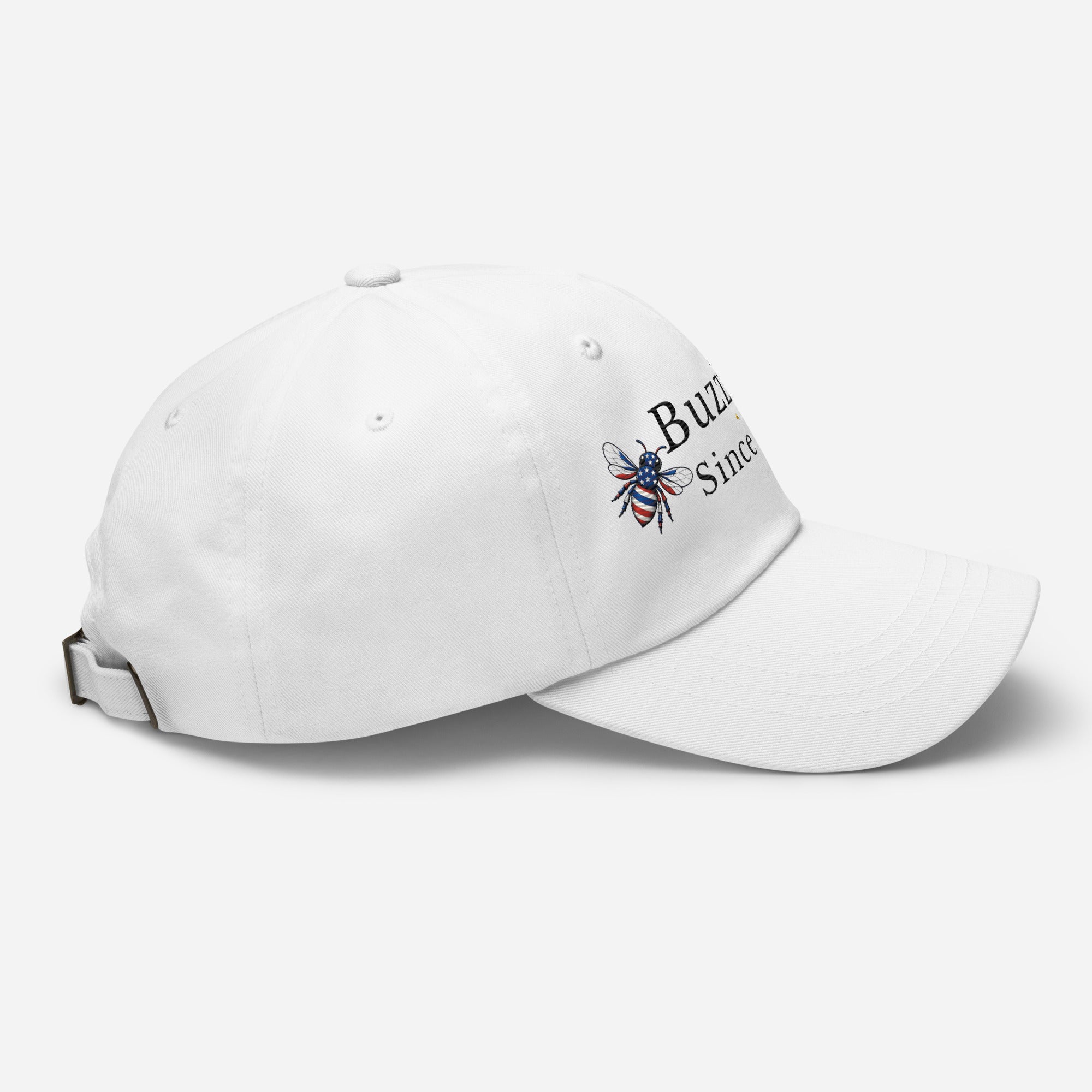 White dad hat with embroidered bee logo on side, curved brim