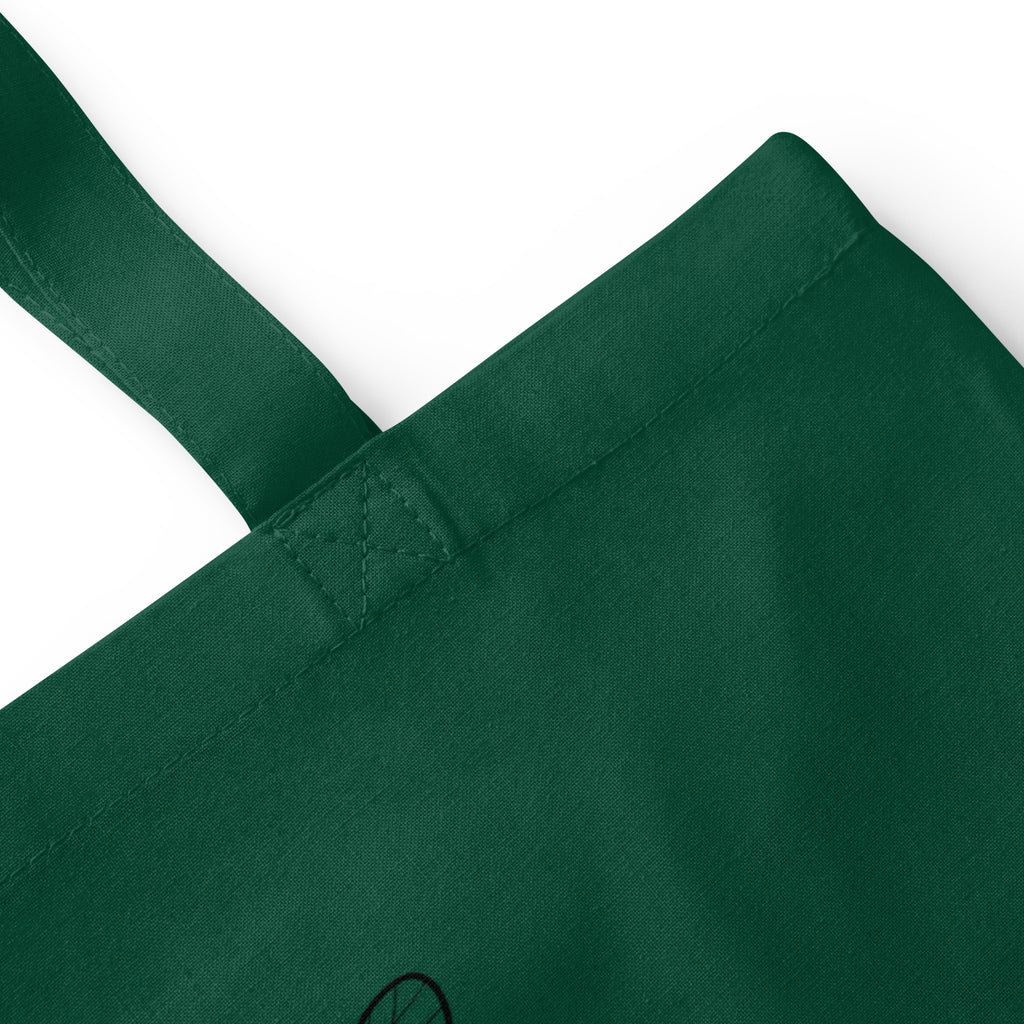 Bottle green cotton tote bag close-up of reinforced handle stitching and seam