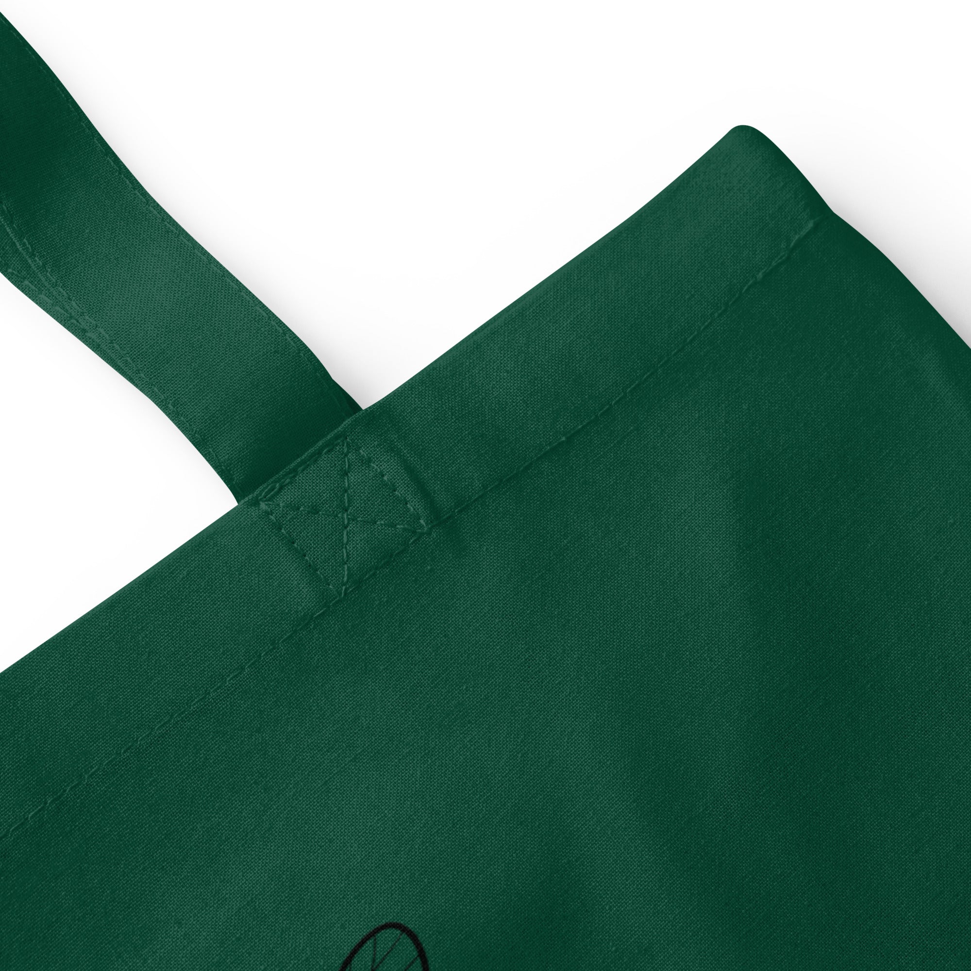 Bottle green cotton tote bag close-up of reinforced handle stitching and seam