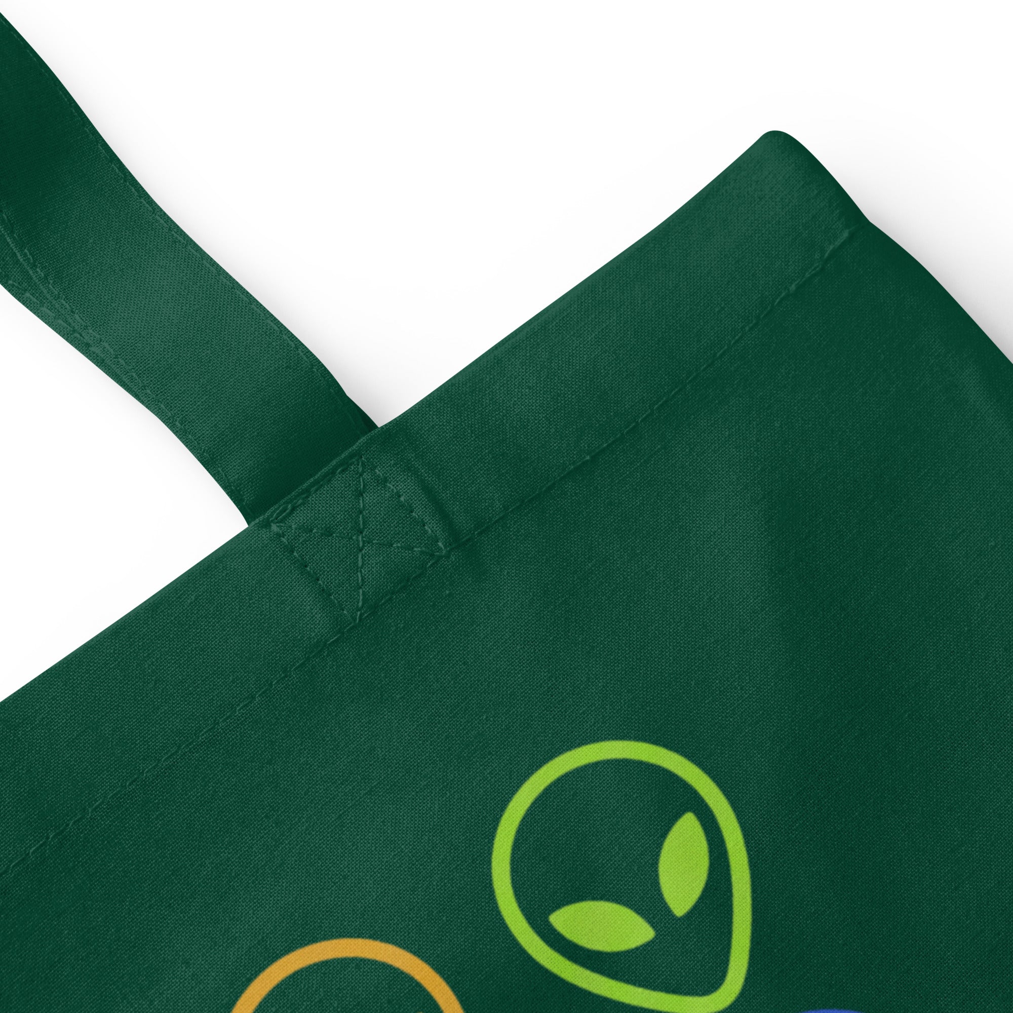 Bottle green cotton tote bag with alien face graphic patch on front