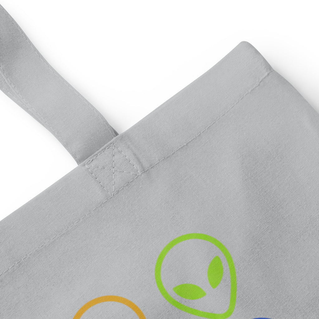 Light gray cotton tote bag with alien face graphic patch on front