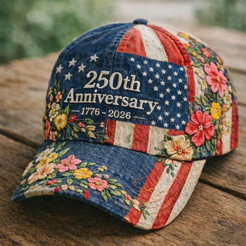 Baseball cap in blue and red-white stripes with “250th Anniversary 1776–2026” and roses