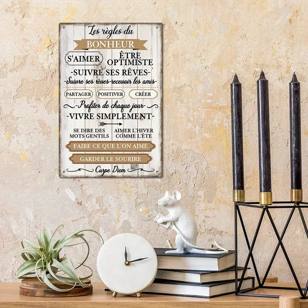 Rectangular metal wall sign with French quote text and distressed cream finish