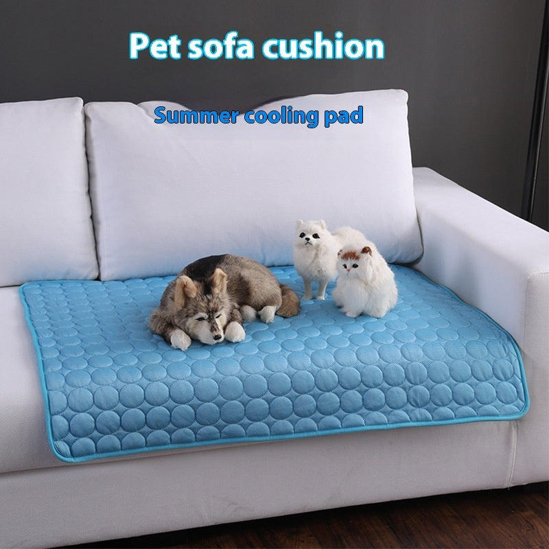 Blue pet cooling mat with textured hex top, dogs resting on it