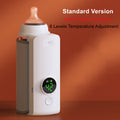 Baby bottle warmer with bottle inserted and glowing digital temperature display