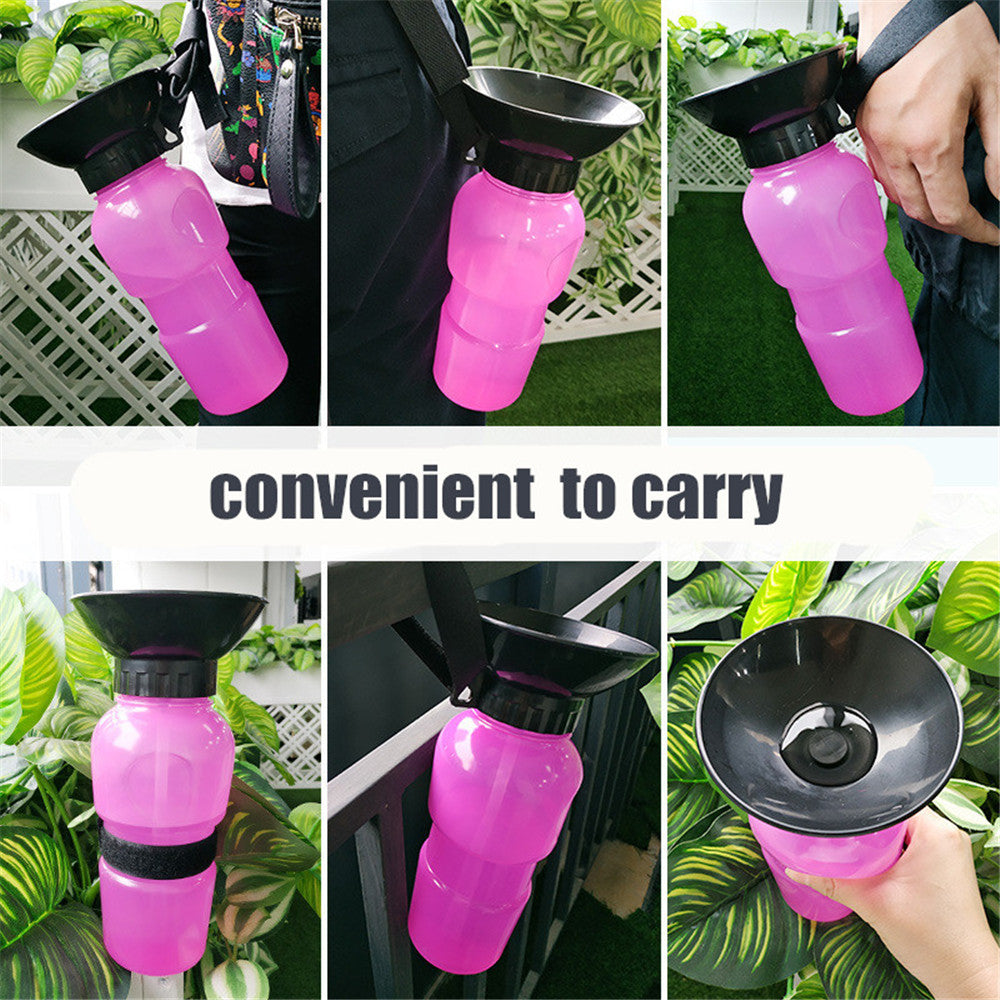 Pink portable pet water bottle with attached black drinking bowl and black carry strap.