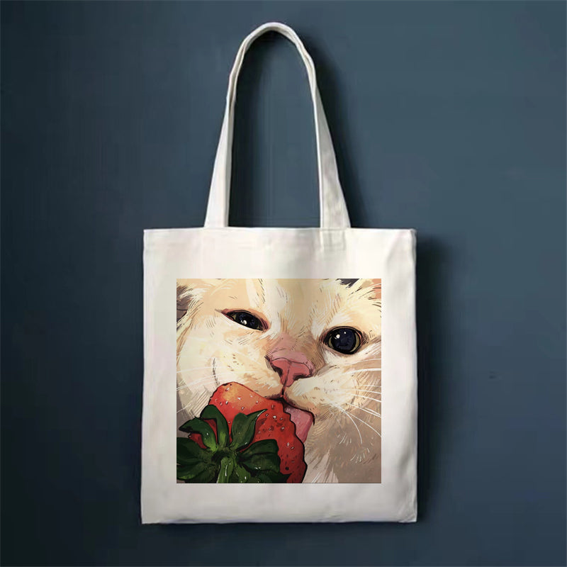 Canvas tote bag with close-up cat face illustration, square front print and long handles