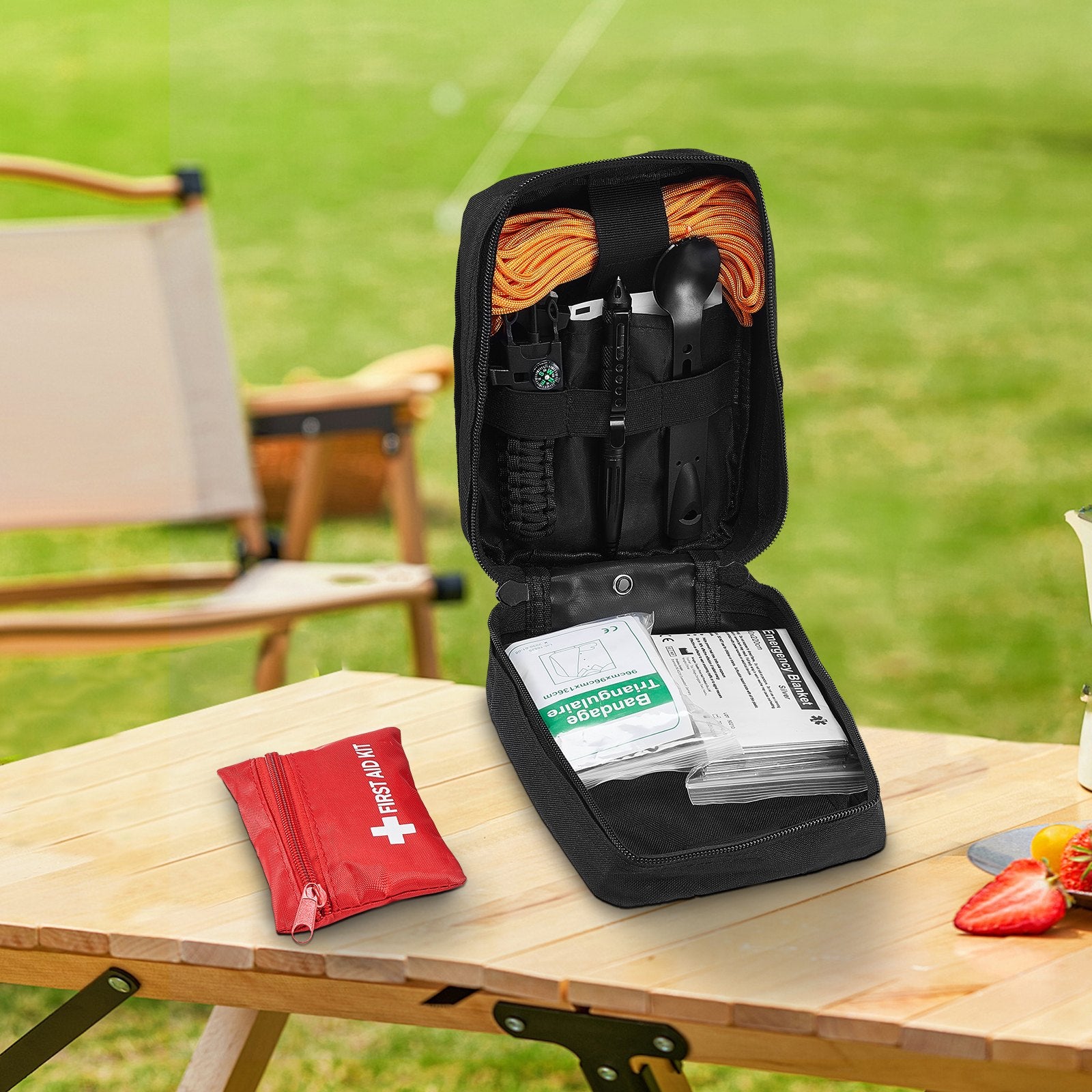 Black first aid kit bag open, showing elastic organizer pouches and supplies inside