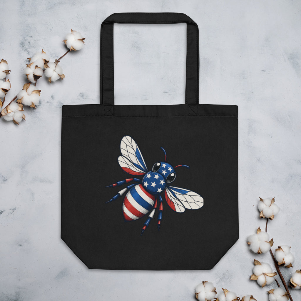 Black tote bag with bee artwork on front, reinforced handles and flat bottom