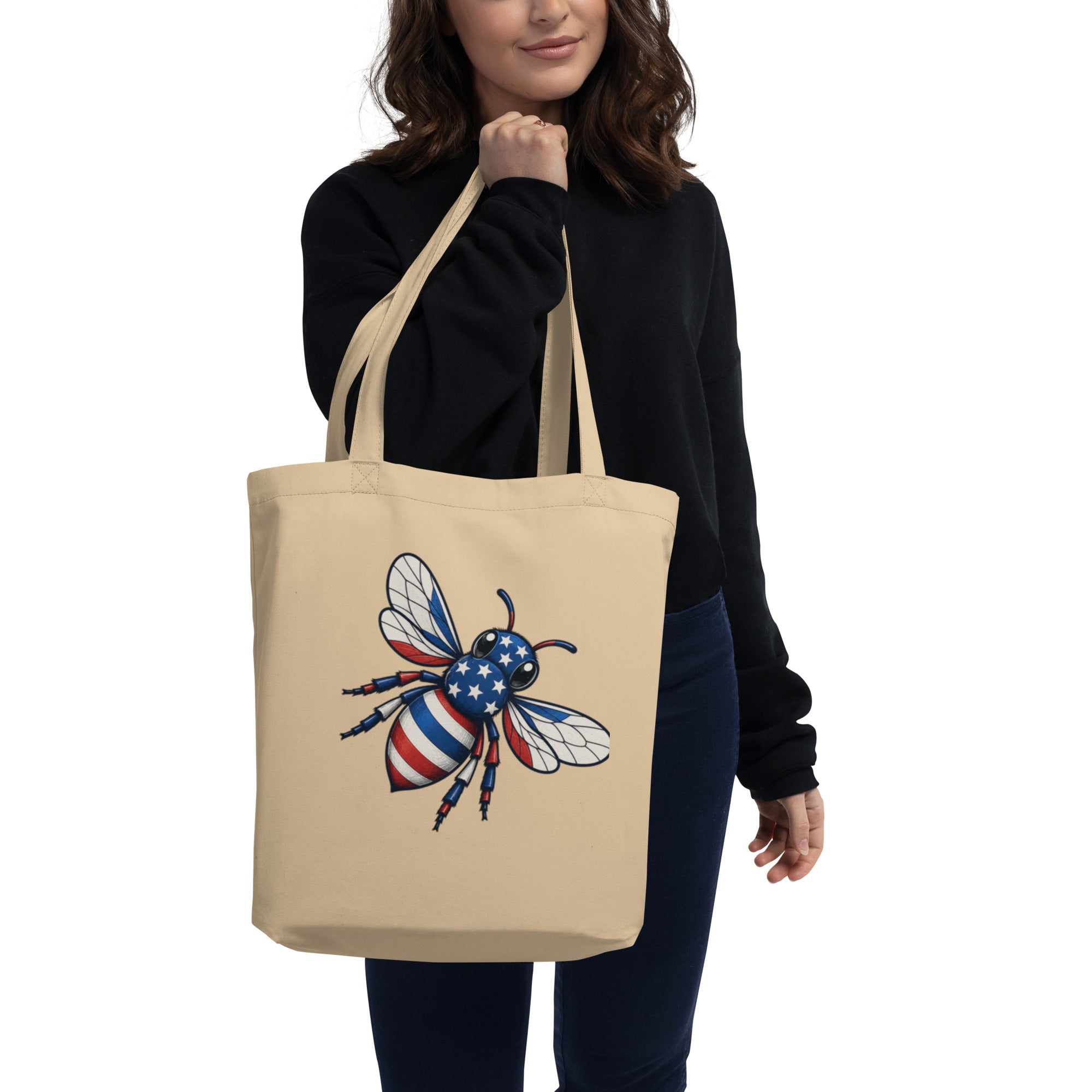 Black eco tote bag with colorful bee graphic, wide handles and stitched top edge