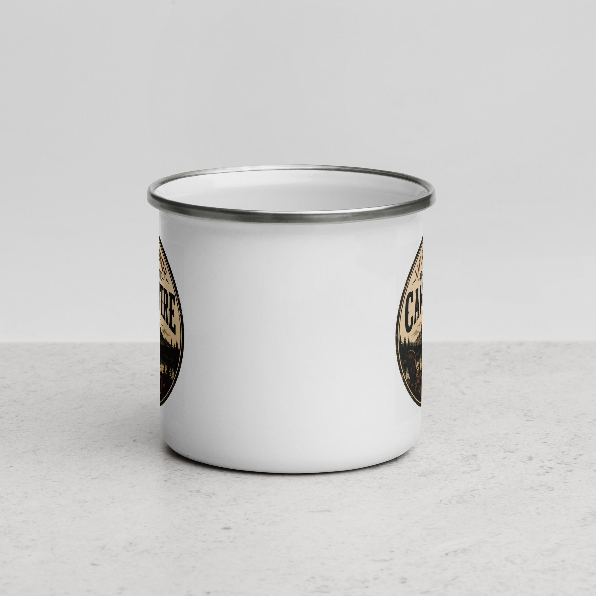 White enamel mug with silver rim, close-up of partial side graphic