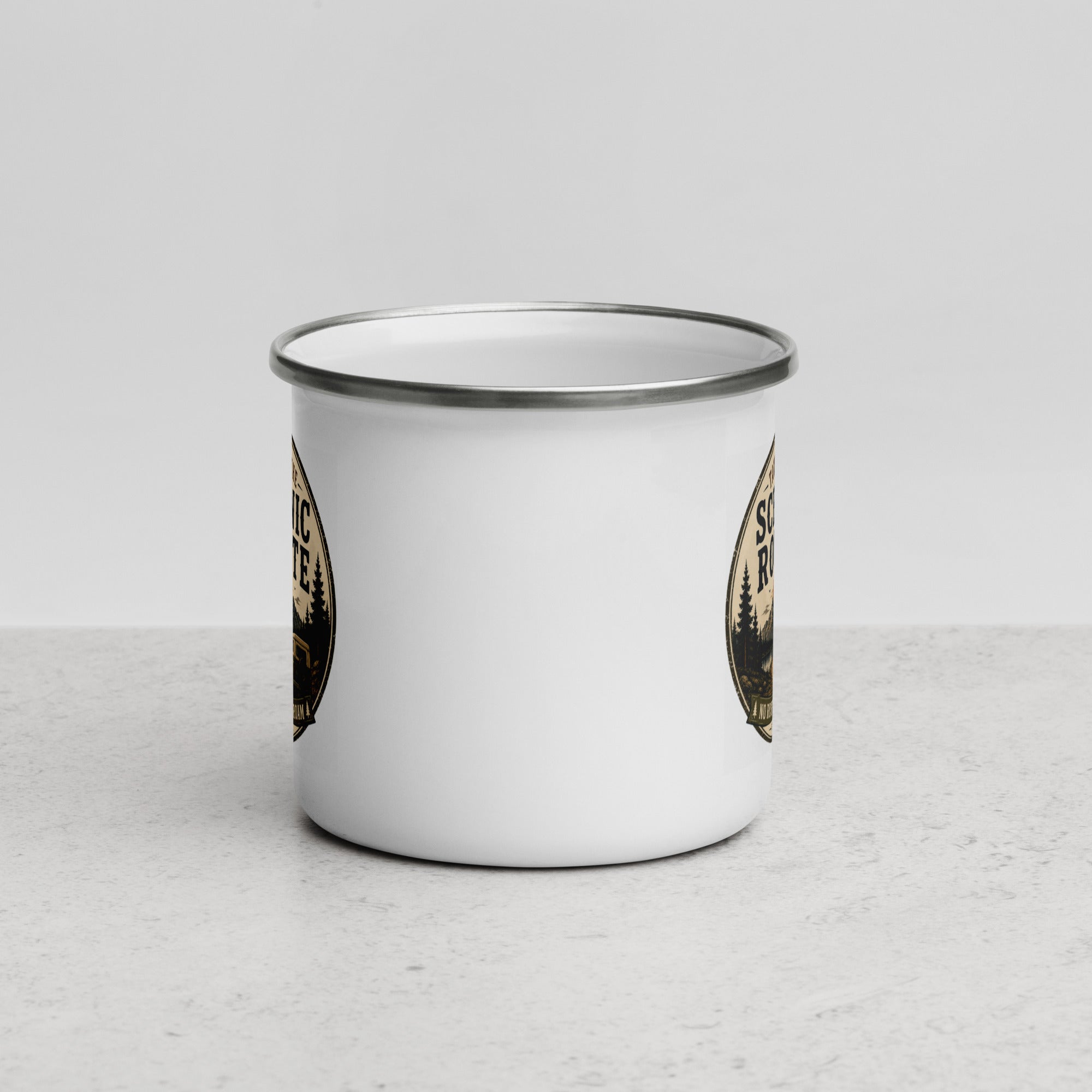 White enamel mug with silver rim, partial Scenic Route graphics on both sides.