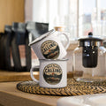 White enamel mug with silver rim and calling logo on front