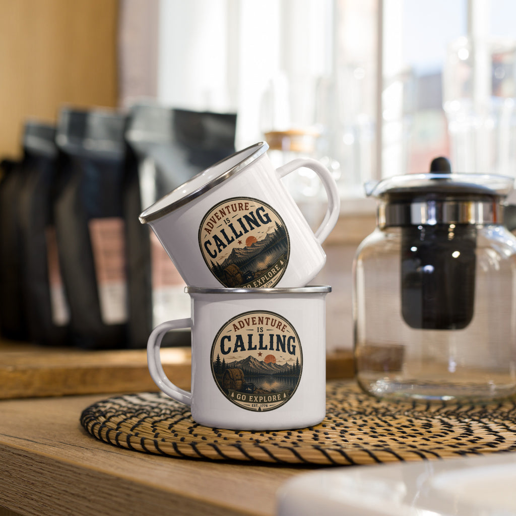 White enamel camping mug with silver rim, round “Adventure is Calling” logo.