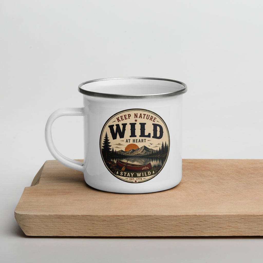 White enamel mug with Wild logo and side handle, gray rim on wooden board