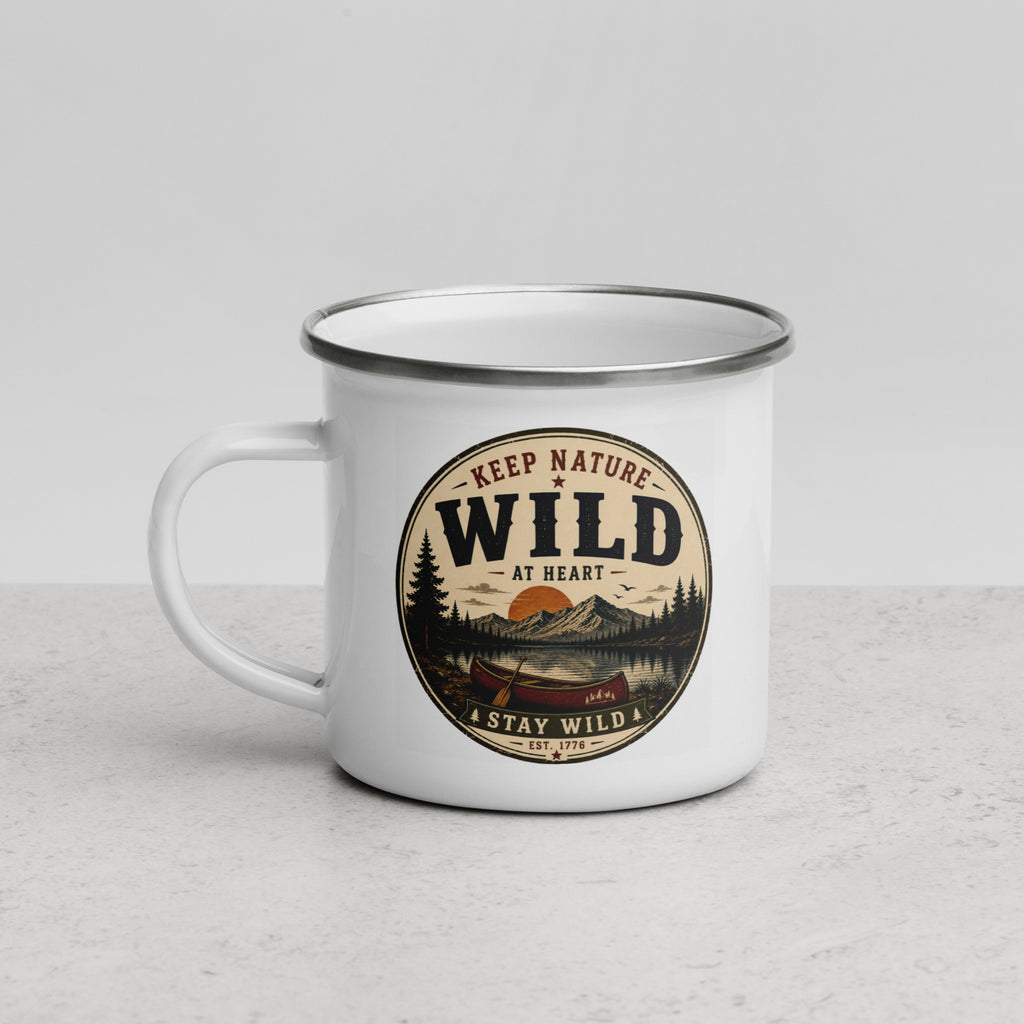 White enamel mug with Wild logo, gray rim and side handle on light stone surface