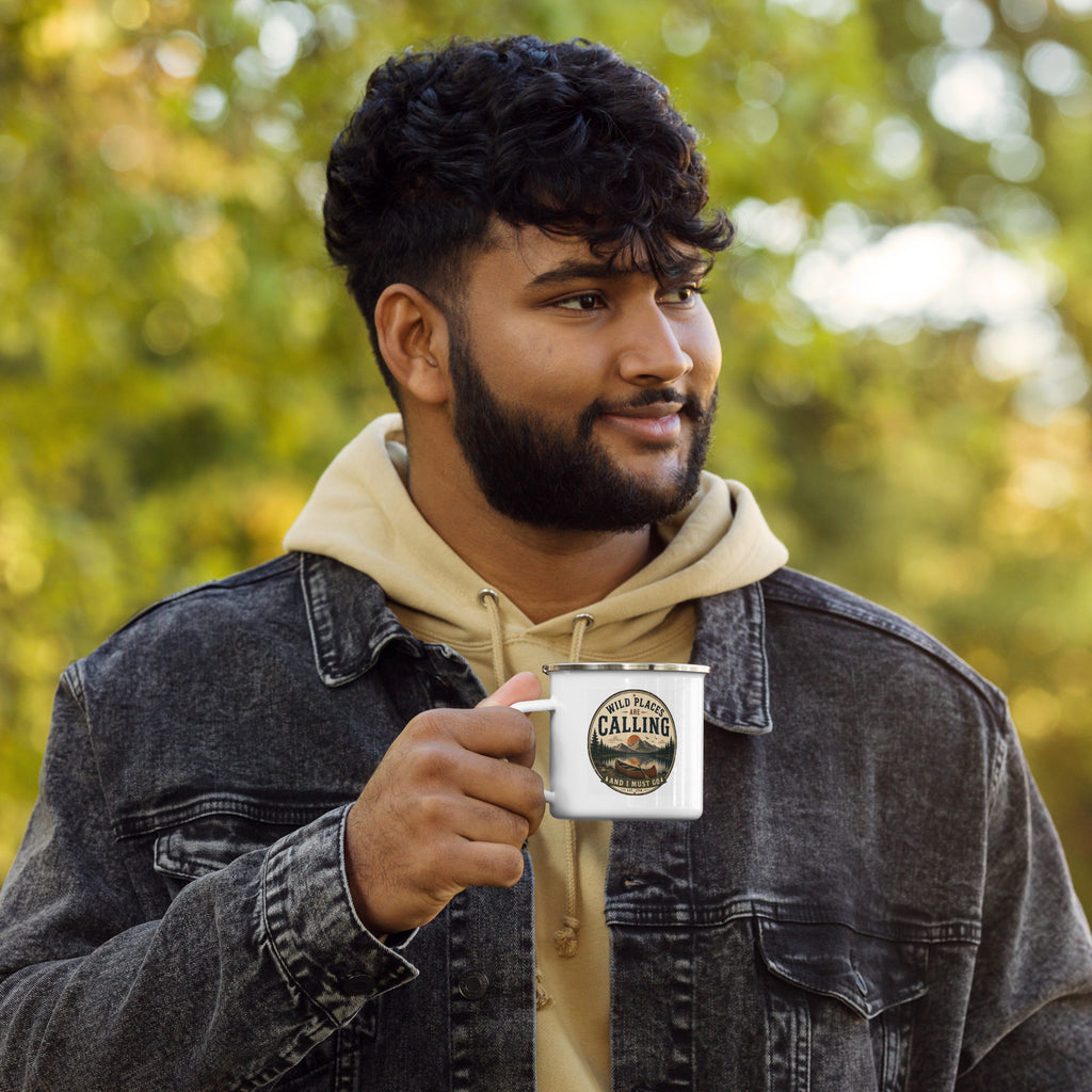 White enamel mug held in hand, silver rim and calling logo visible
