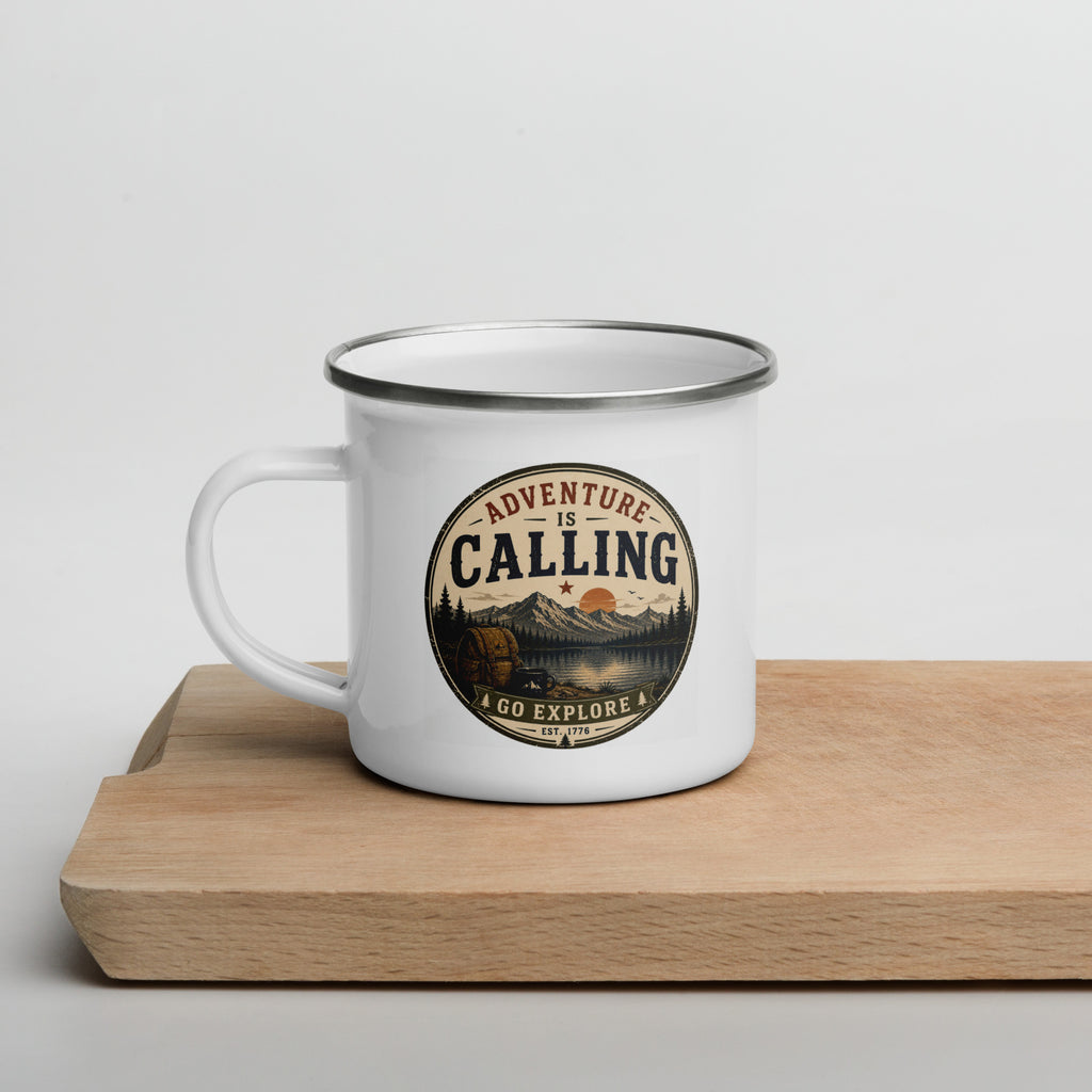 White enamel mug with silver rim and 'Adventure Is Calling' circular logo, angled view