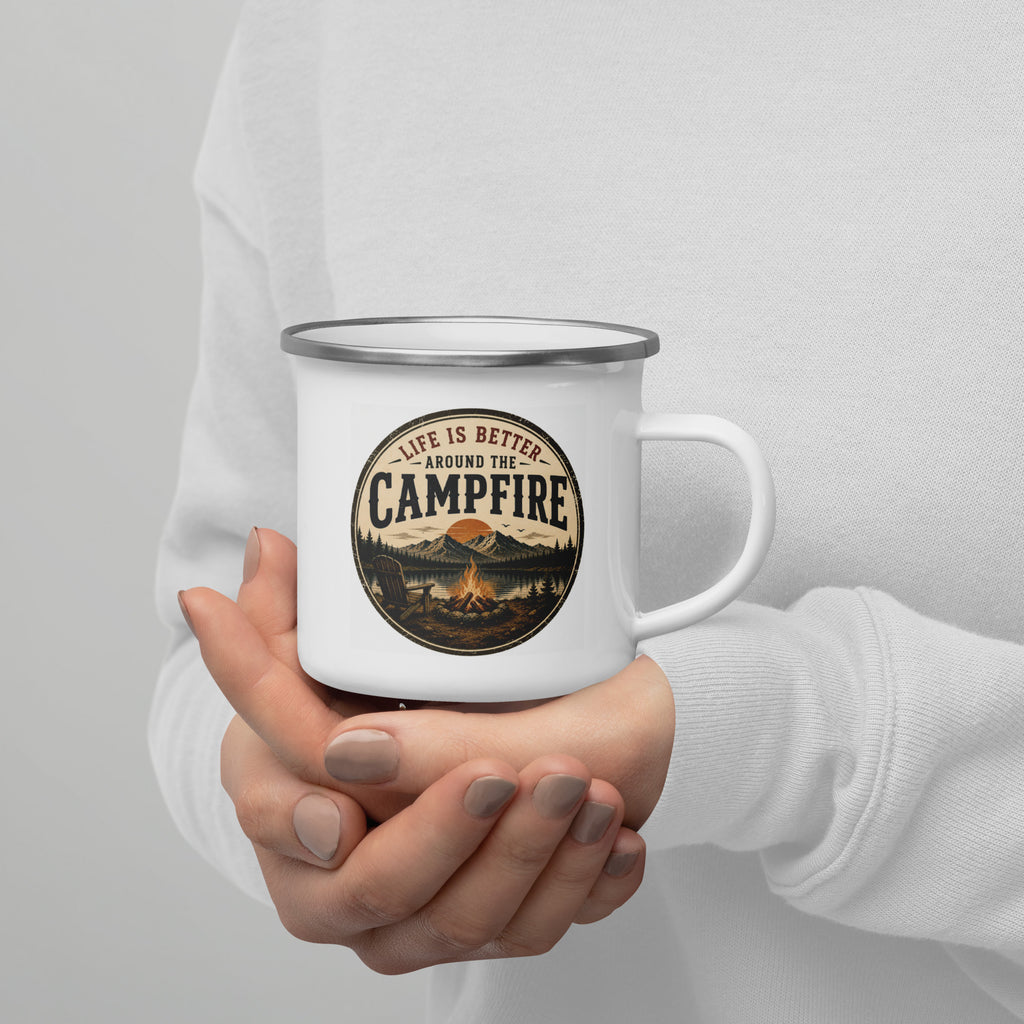 White enamel mug with silver rim, Campfire logo, held near chest