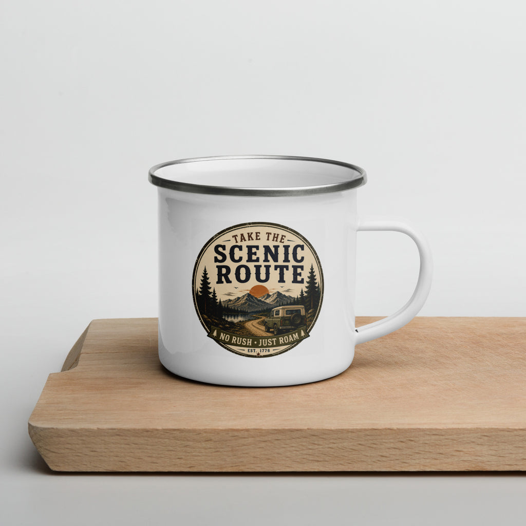 White enamel mug with Scenic Route logo on the front, silver rim and side handle.
