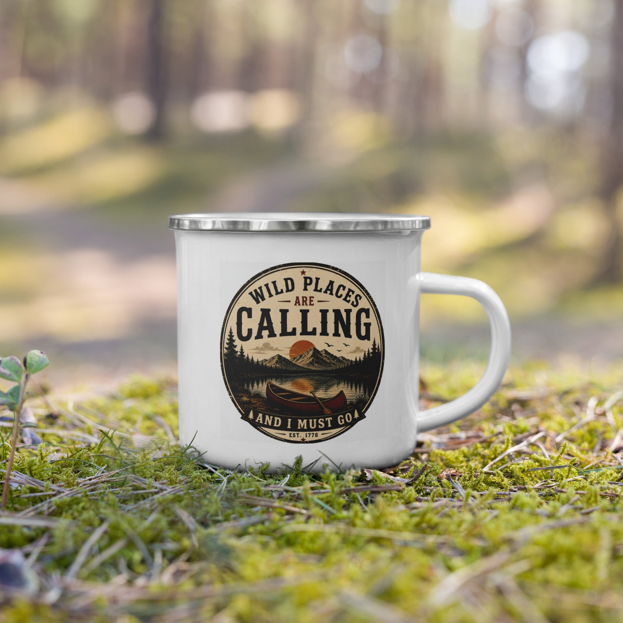 White enamel mug on ground, silver rim and calling logo front