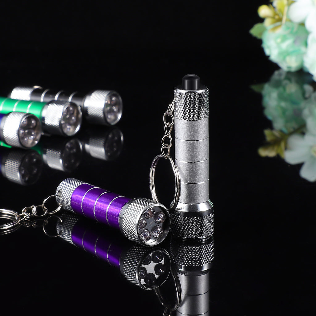 Aluminum LED keychain flashlight with purple tube and silver head, chain keyring