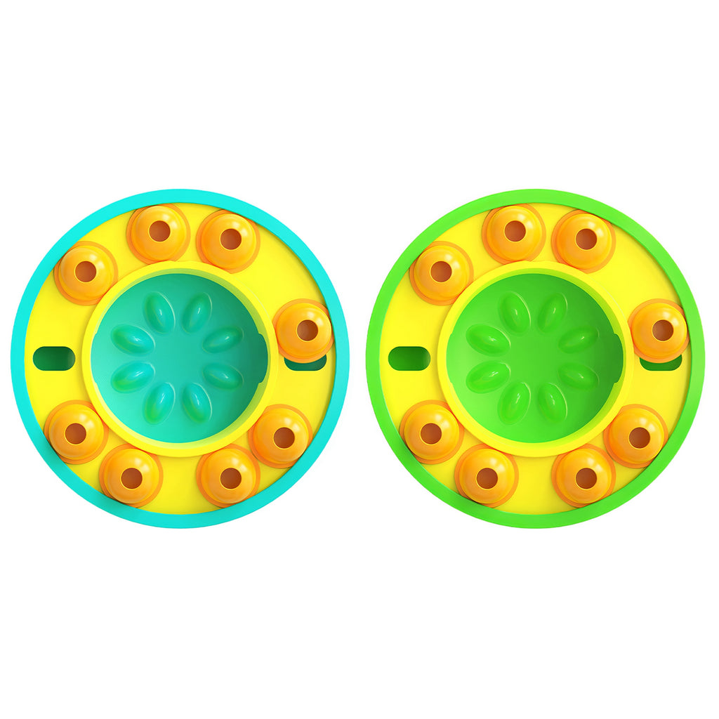 Two slow-feeder dog bowls with yellow bases and green centers, orange treat wells