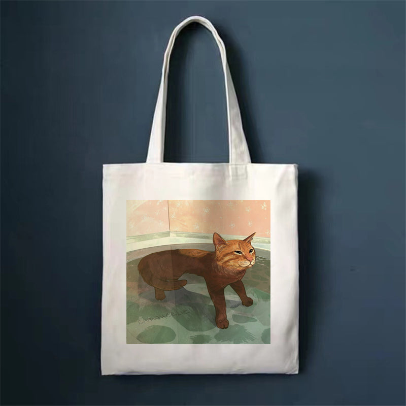 Canvas tote bag with orange cat illustration, square front print and long handles
