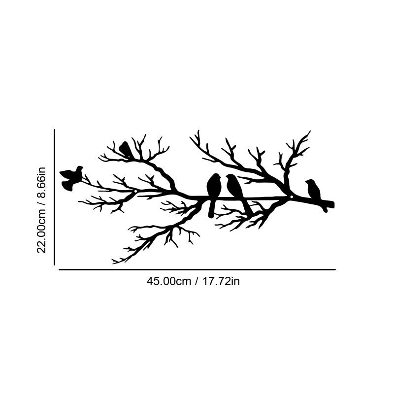 Abstract iron wall hanging with black bird silhouettes on branching vines