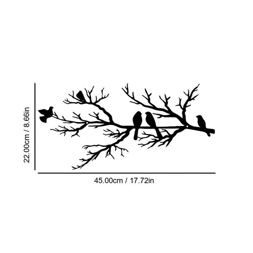 Abstract iron wall hanging with black bird silhouettes on branching vines