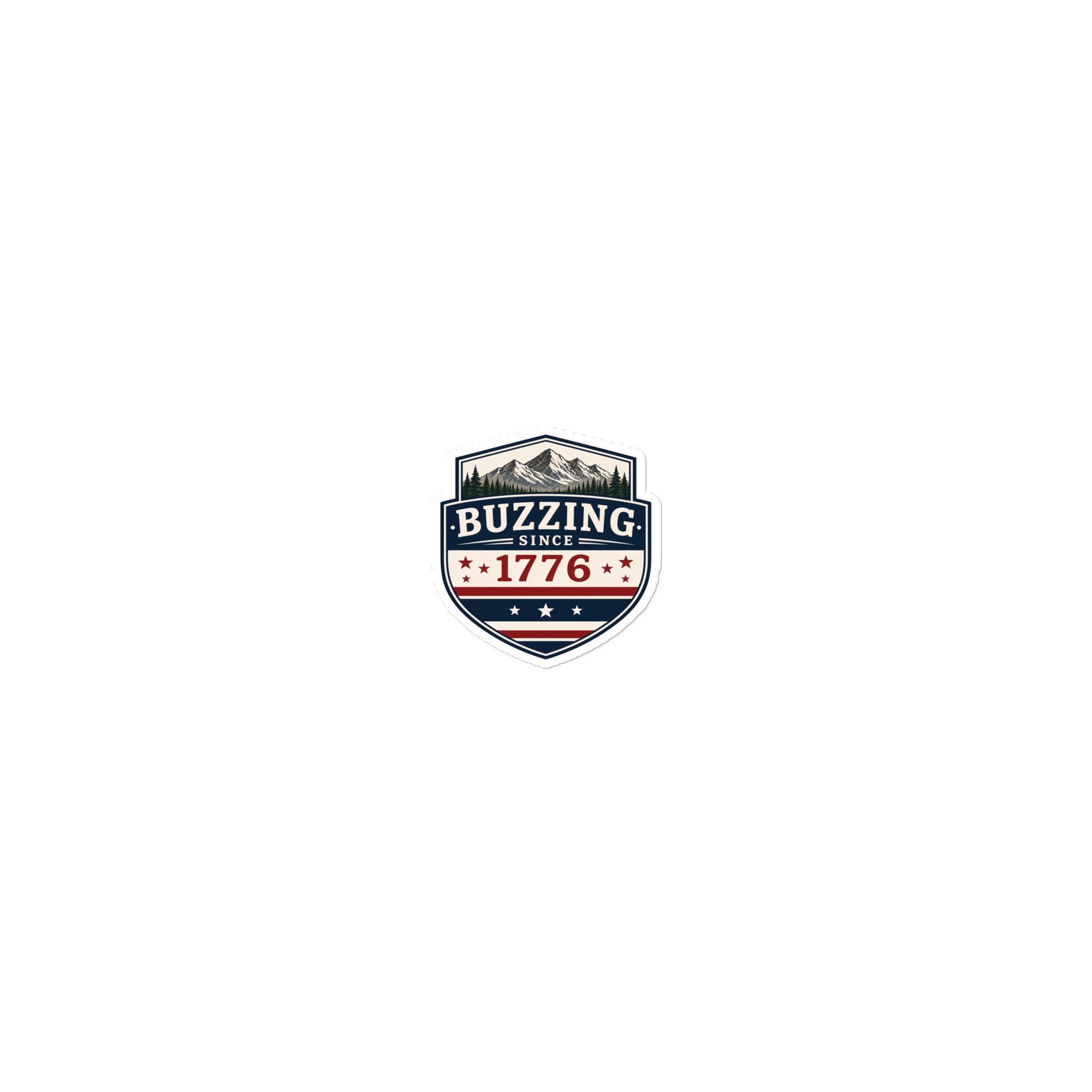 Small shield-shaped sticker with 'BUZZING' and 'SINCE 1776' over mountains and stars.