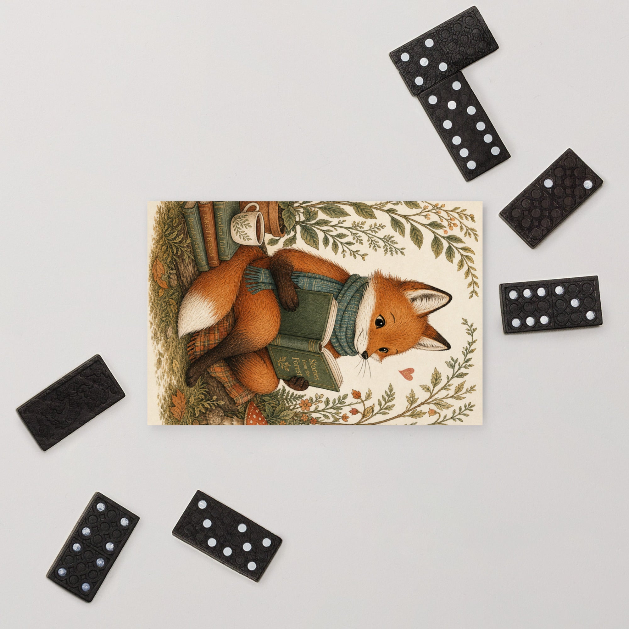 Woodland fox postcard featuring a fox with green satchel and books, bordered by leaves