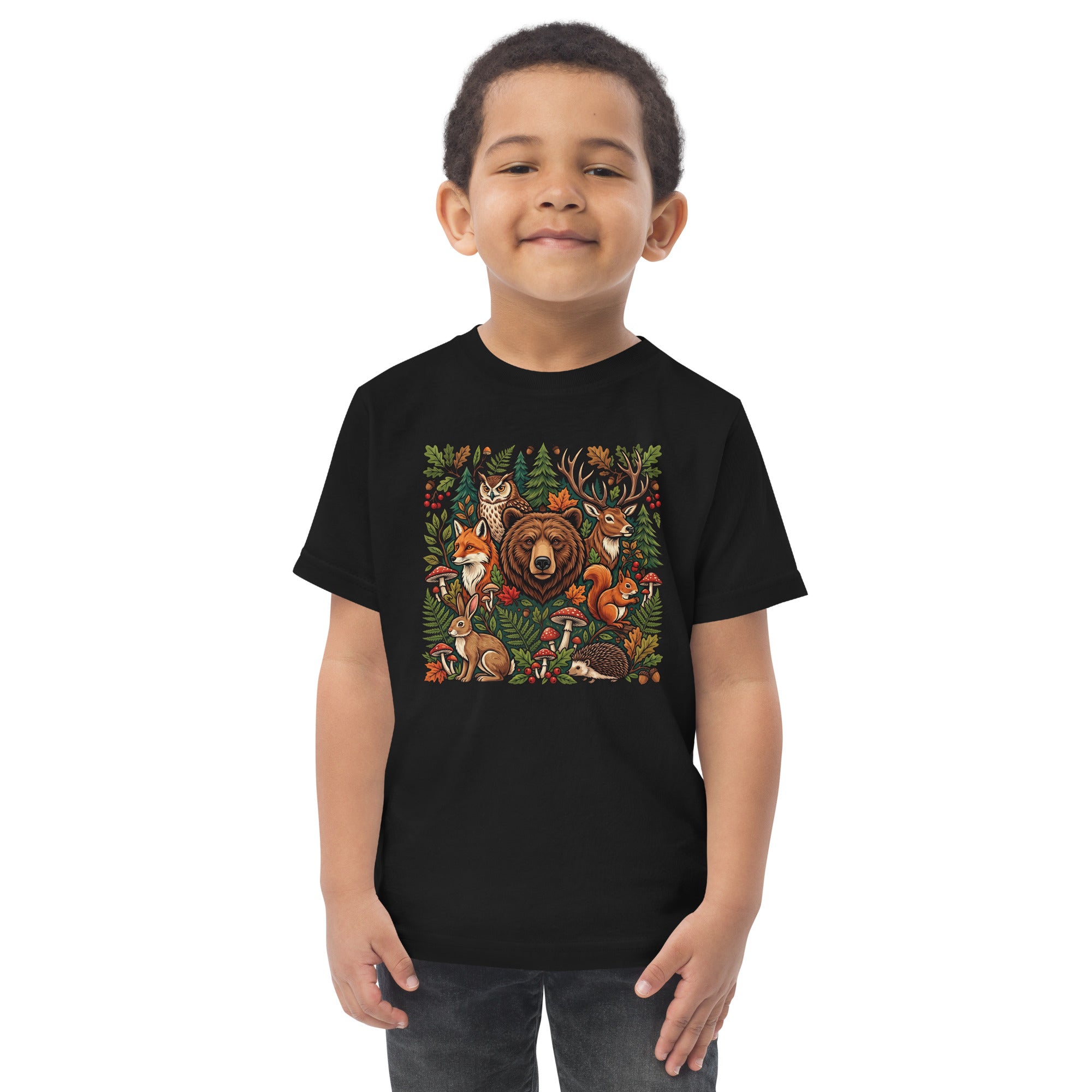 Black toddler T-shirt on child model with colorful woodland wildlife front graphic.