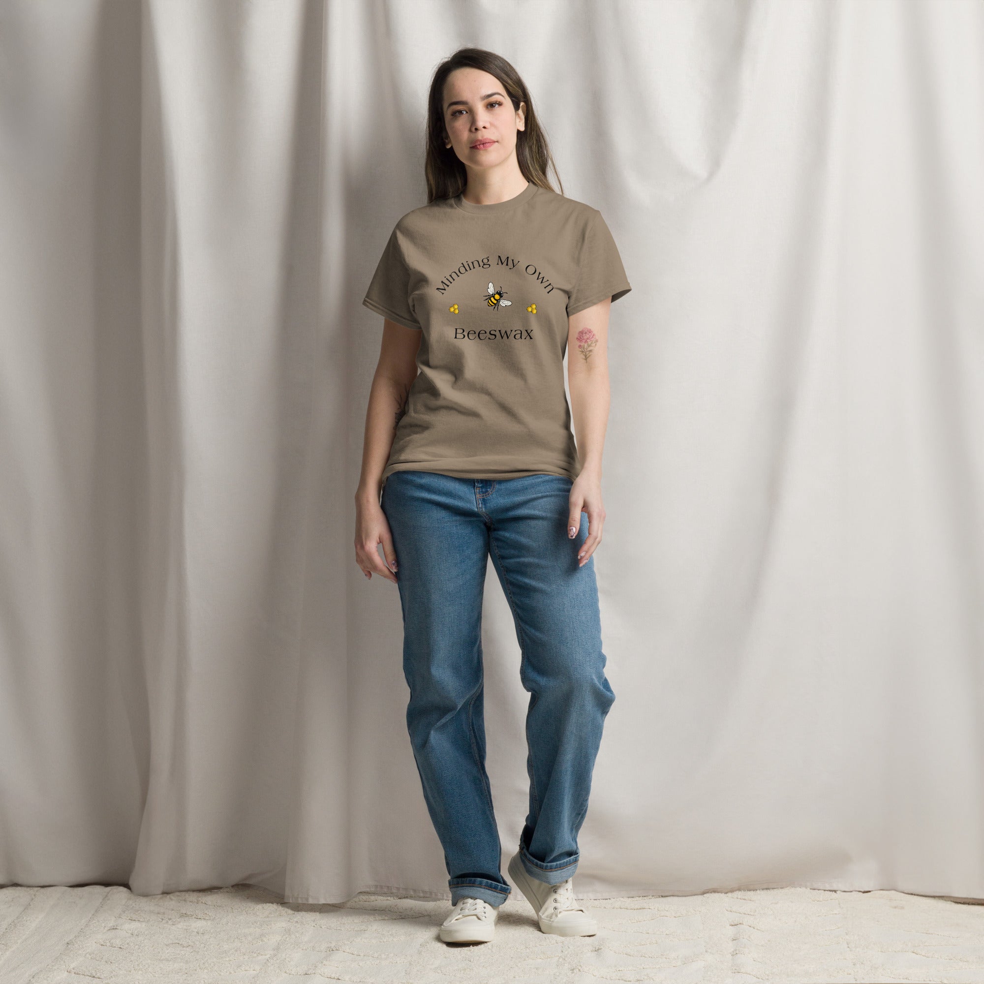 Brown unisex T-shirt with round neck and bee graphic with text on chest.