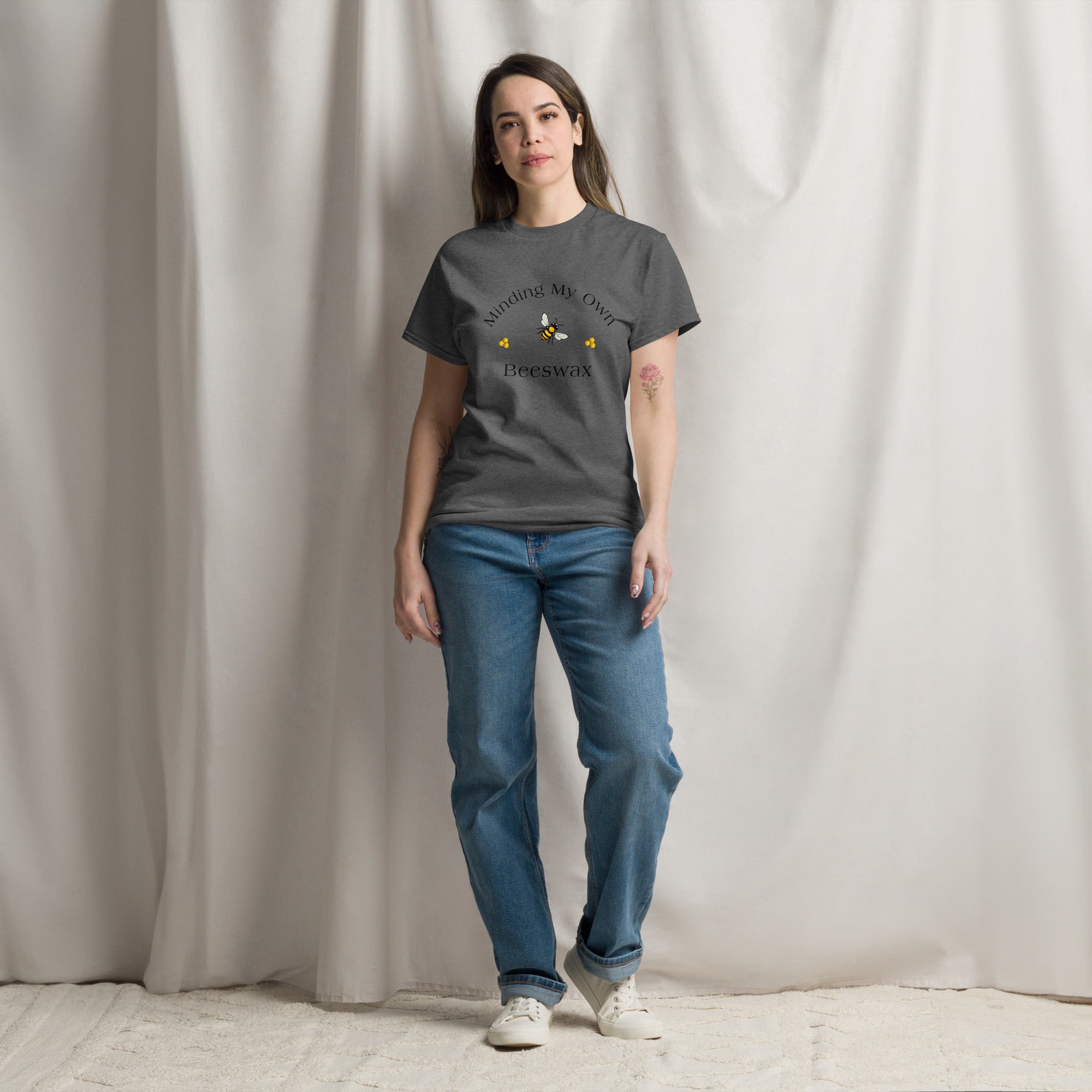 Dark gray unisex T-shirt with round neck and small bee graphic on chest.